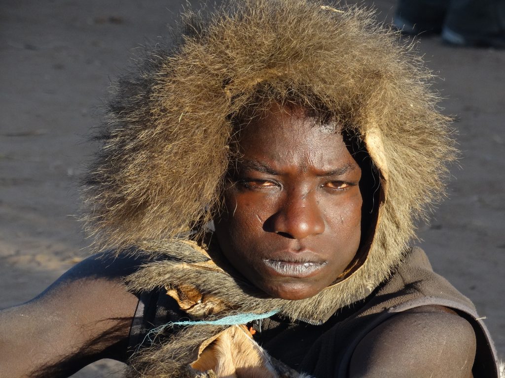 hadzabe man in tanzania with a cap made with fur